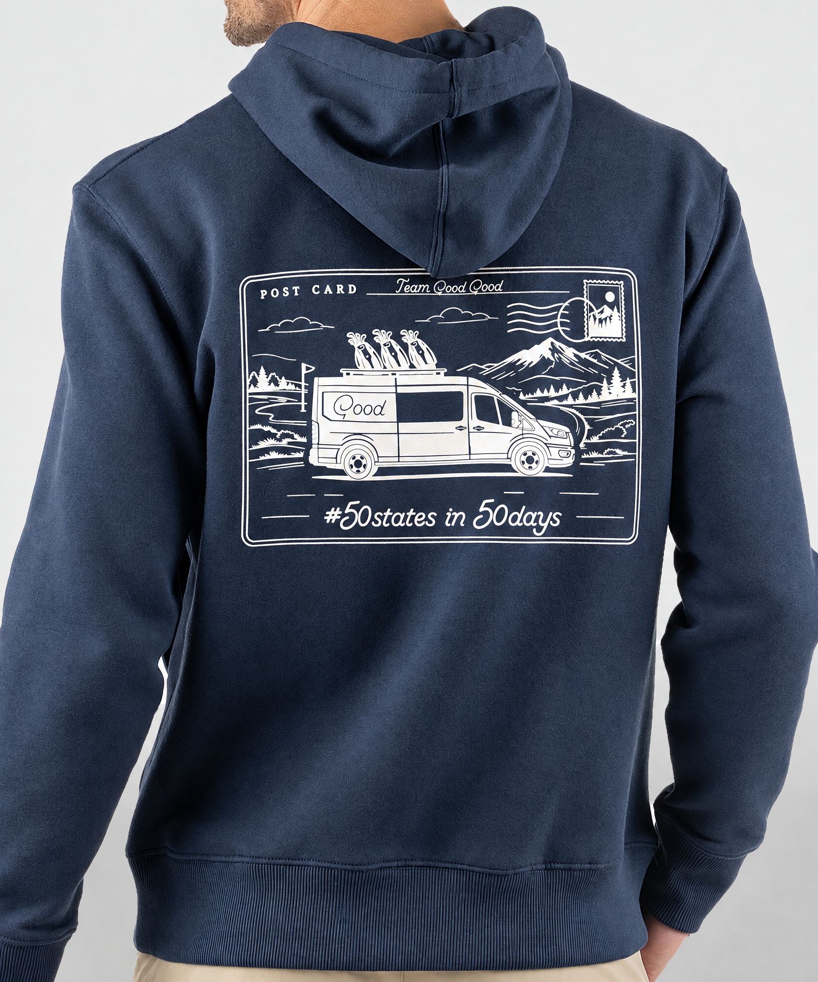 Good Days Ahead Fleece Hoodie in navy, back view on model showing white postcard graphic