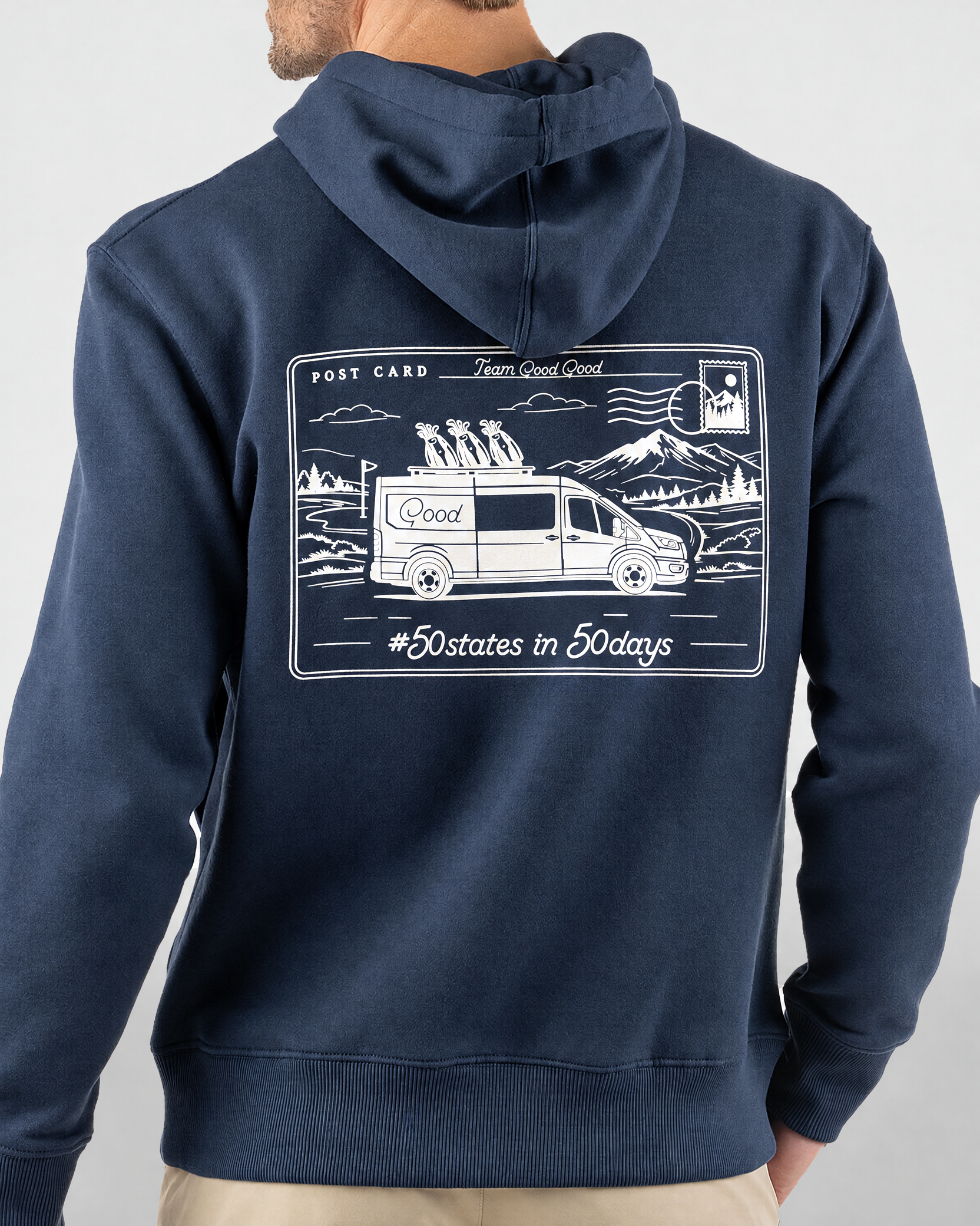Good Days Ahead Fleece Hoodie in navy, back view on model showing white postcard graphic