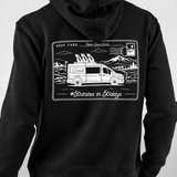 Keep Playing Fleece Hoodie in black, back view on model showing white postcard graphic