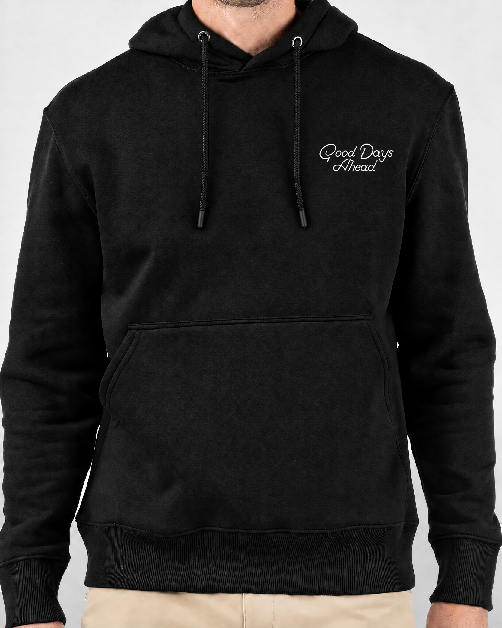 Keep Playing Fleece Hoodie in black, front view on model with white Good Days Ahead chest print